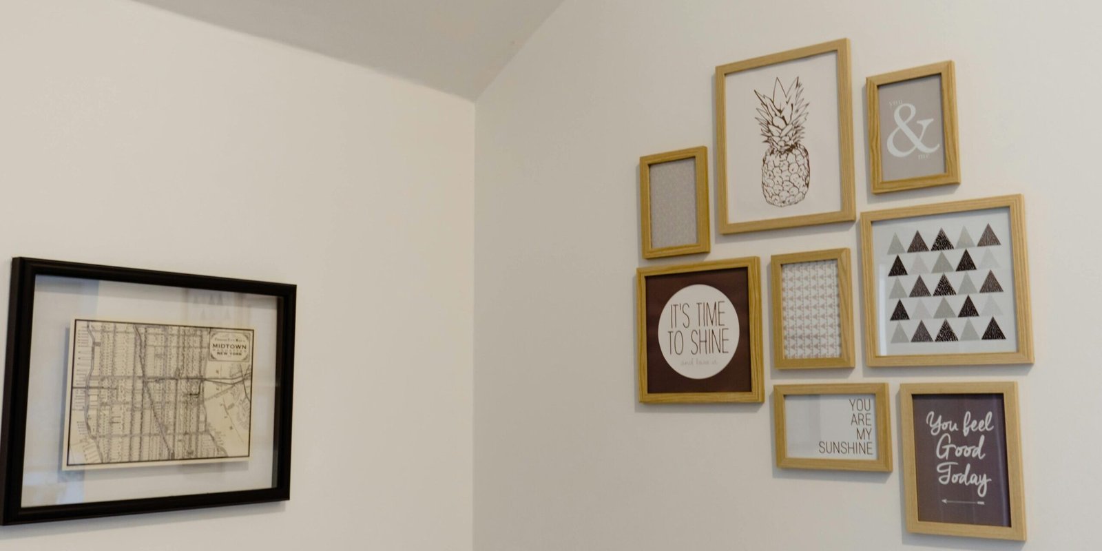 A chic arrangement of picture frames on a white wall adds a modern touch to your space.